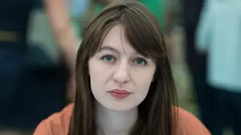 Irish author Sally Rooney claims she cannot visit the UK because of potential arrest